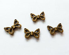 Load image into Gallery viewer, 10 Butterfly Wing Beads Antiqued Bronze Wing Beads Wing Charms Bead Frames Butterfly Charms 10pcs 15mm